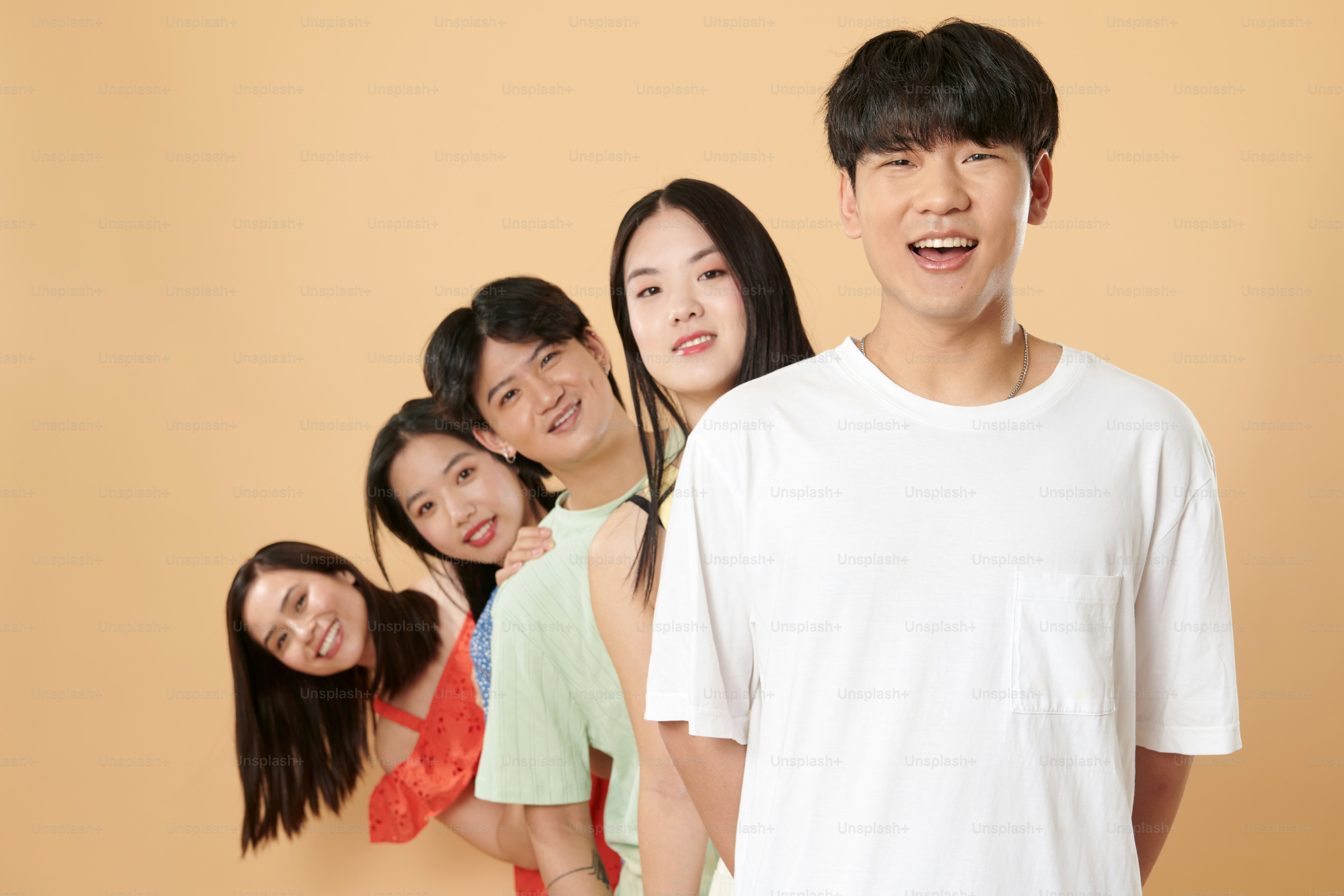 A group of young people standing next to each other